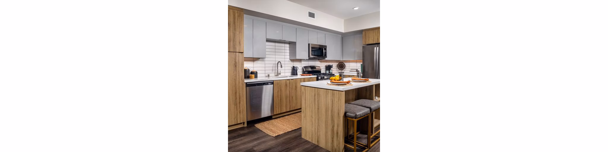 Modern kitchen with sleek countertops and stainless steel appliances in Paloma Apartments