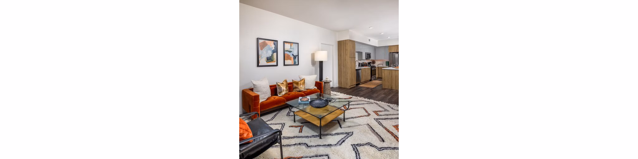 Modern living room with stylish furniture and abundant natural light at Paloma Apartments, a luxury property by Greystar