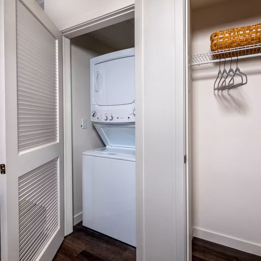 Modern laundry room with energy-efficient washers and dryers at Paloma Apartments
