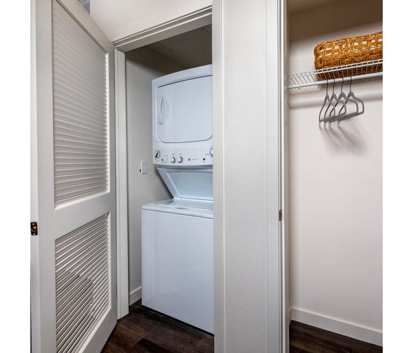 Modern laundry room with energy-efficient washers and dryers at Paloma Apartments