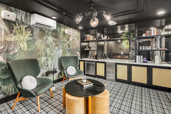 Modern clubhouse featuring communal seating and entertainment spaces at Broadstone Strata Apartments