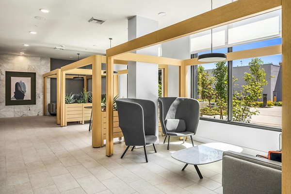 Clubhouse featuring modern design and communal seating at Broadstone Strata Apartments