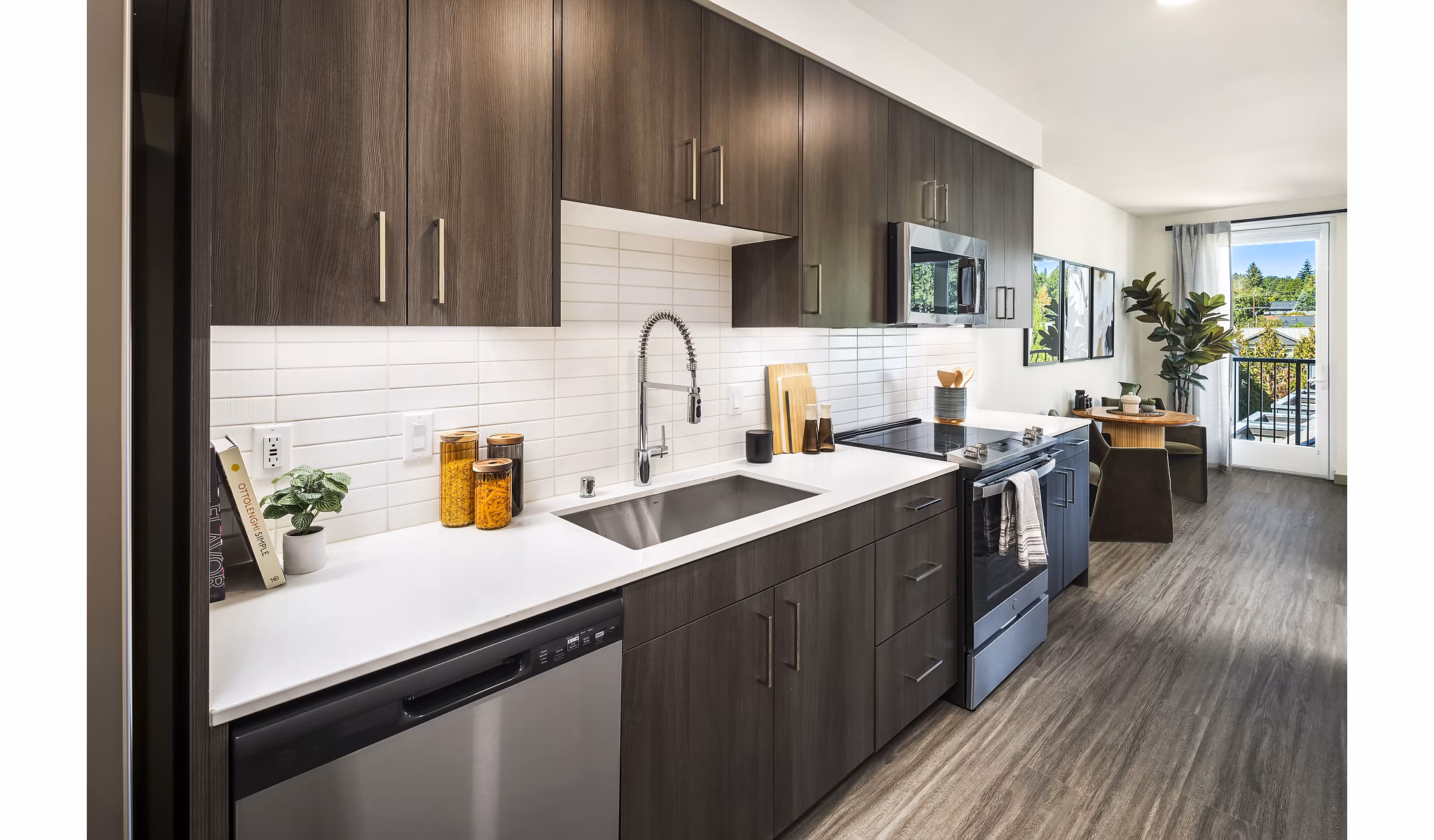 Modern kitchen with stainless steel appliances in Broadstone Strata Apartments