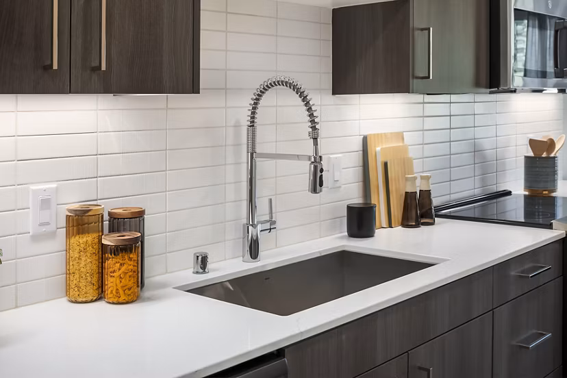 Modern kitchen featuring stainless steel appliances at Broadstone Strata Apartments