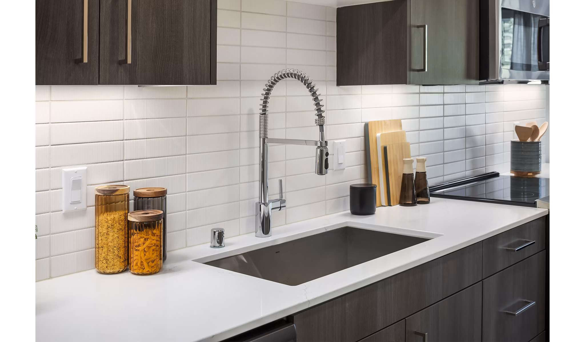 Modern kitchen featuring stainless steel appliances at Broadstone Strata Apartments
