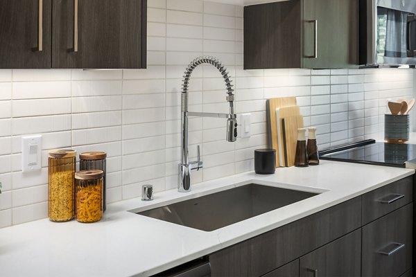 Modern kitchen featuring stainless steel appliances at Broadstone Strata Apartments