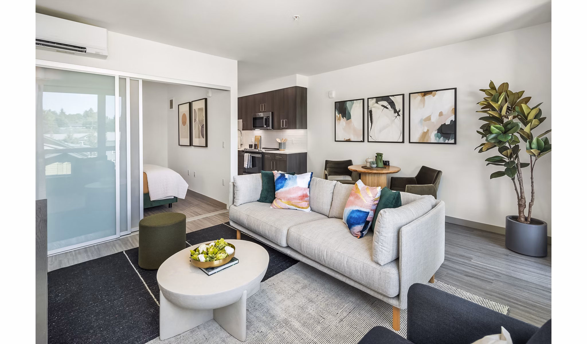 Modern living room with sleek furnishings and natural light at Broadstone Strata, downtown luxury apartments
