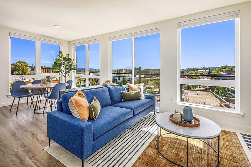 Contemporary living room with sleek design and ample natural light at Broadstone Strata Apartments