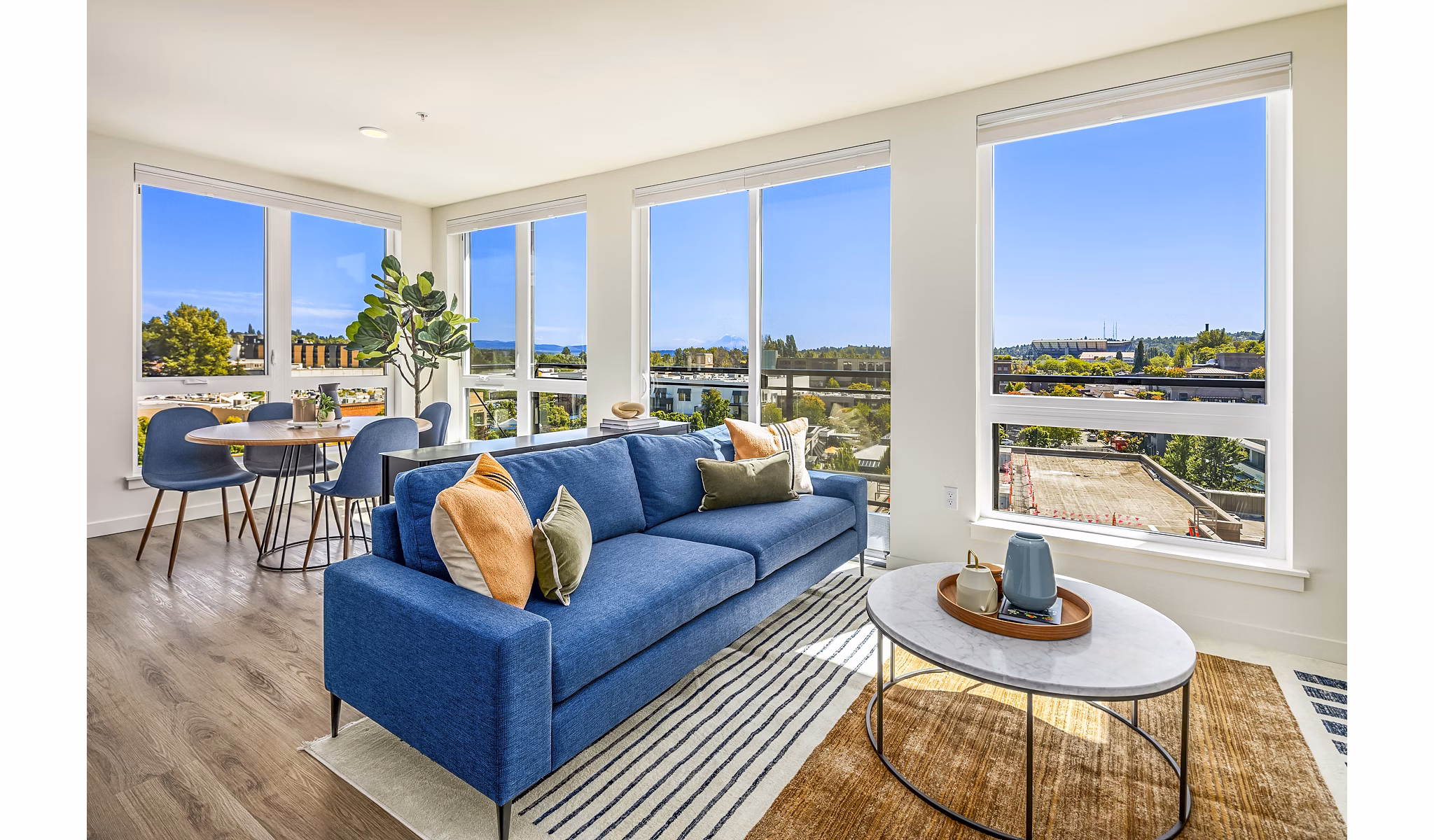 Contemporary living room with sleek design and ample natural light at Broadstone Strata Apartments