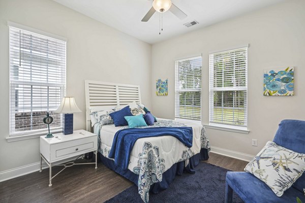 Spacious bedroom with modern decor in Ailsa Village Apartments, luxury living near the city center