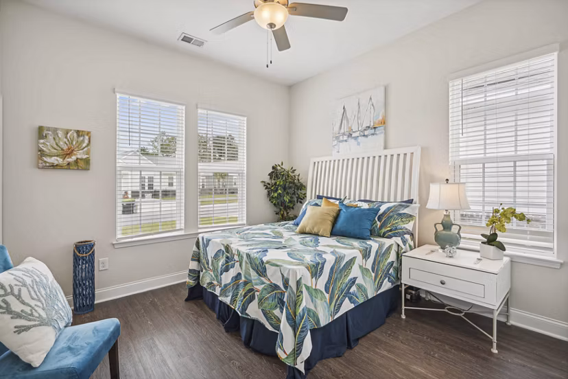 Bright bedroom with modern furnishings at Ailsa Village Apartments