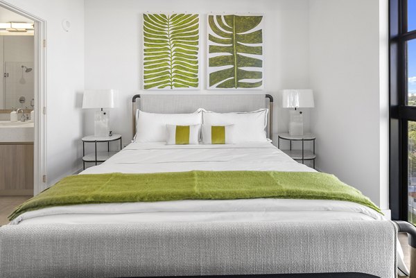 Cozy bedroom with modern decor at Grove Central Residences Apartments