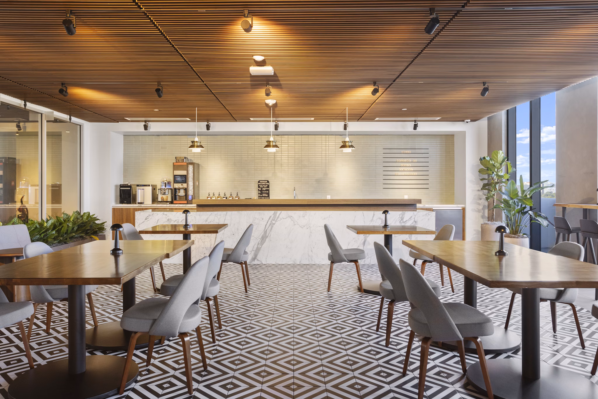 Clubhouse with modern design and cozy seating areas at Grove Central Residences Apartments