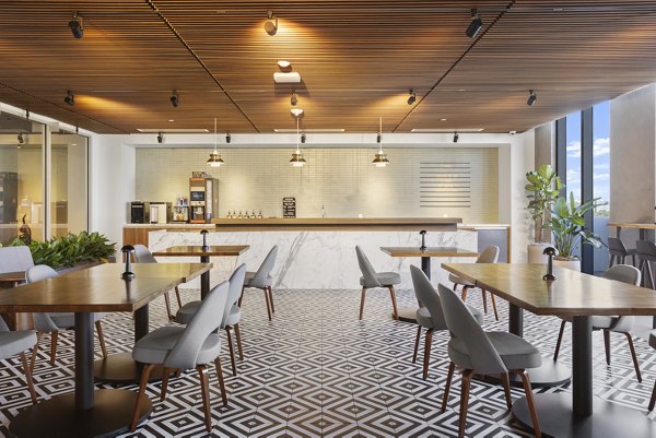 Clubhouse with modern design and cozy seating areas at Grove Central Residences Apartments