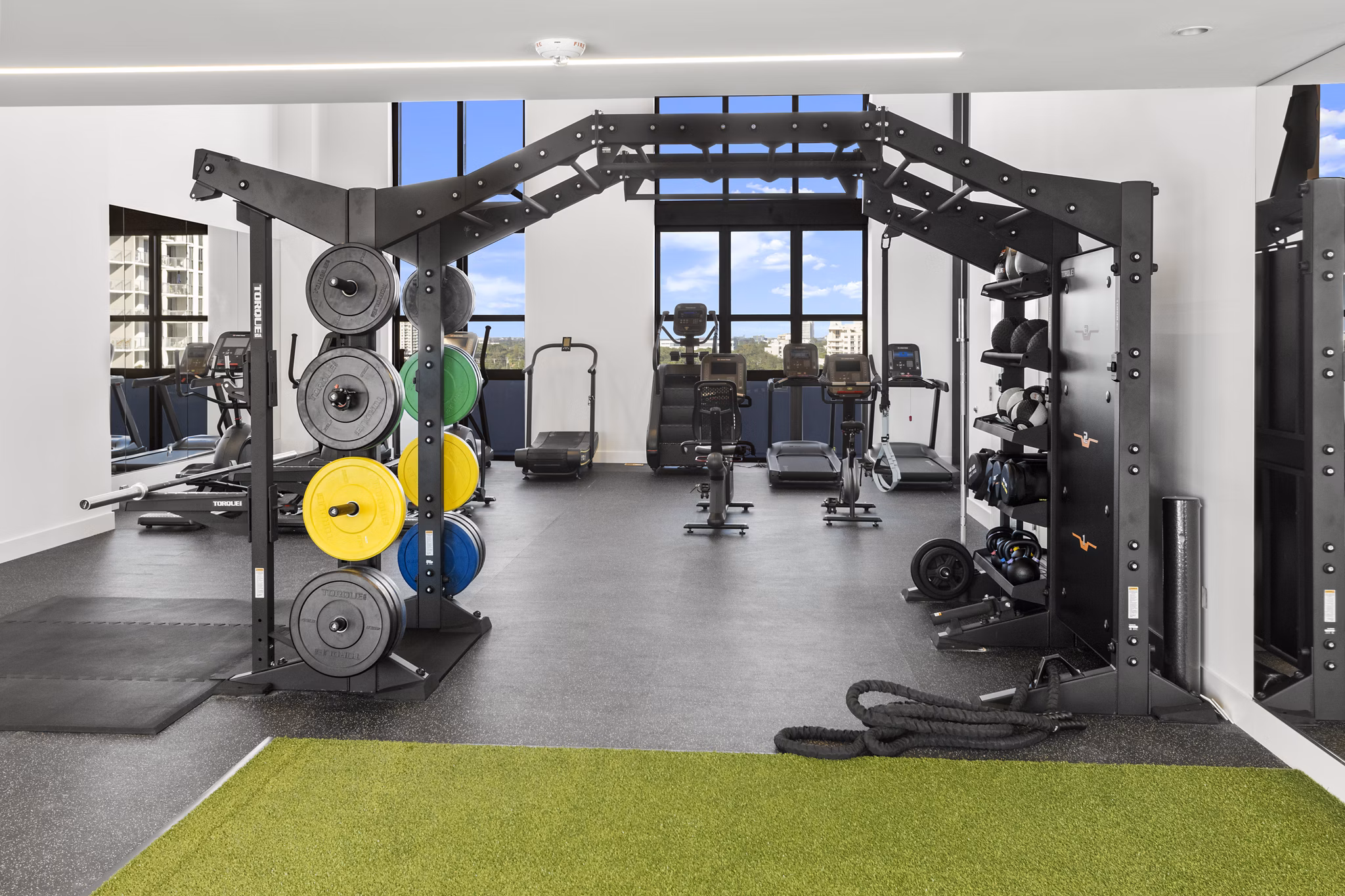 State-of-the-art fitness center at Grove Central Residences Apartments with modern equipment and spacious workout areas