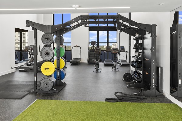 State-of-the-art fitness center at Grove Central Residences Apartments with modern equipment and spacious workout areas