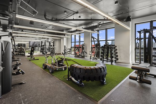 Fitness center with modern equipment at Grove Central Residences Apartments