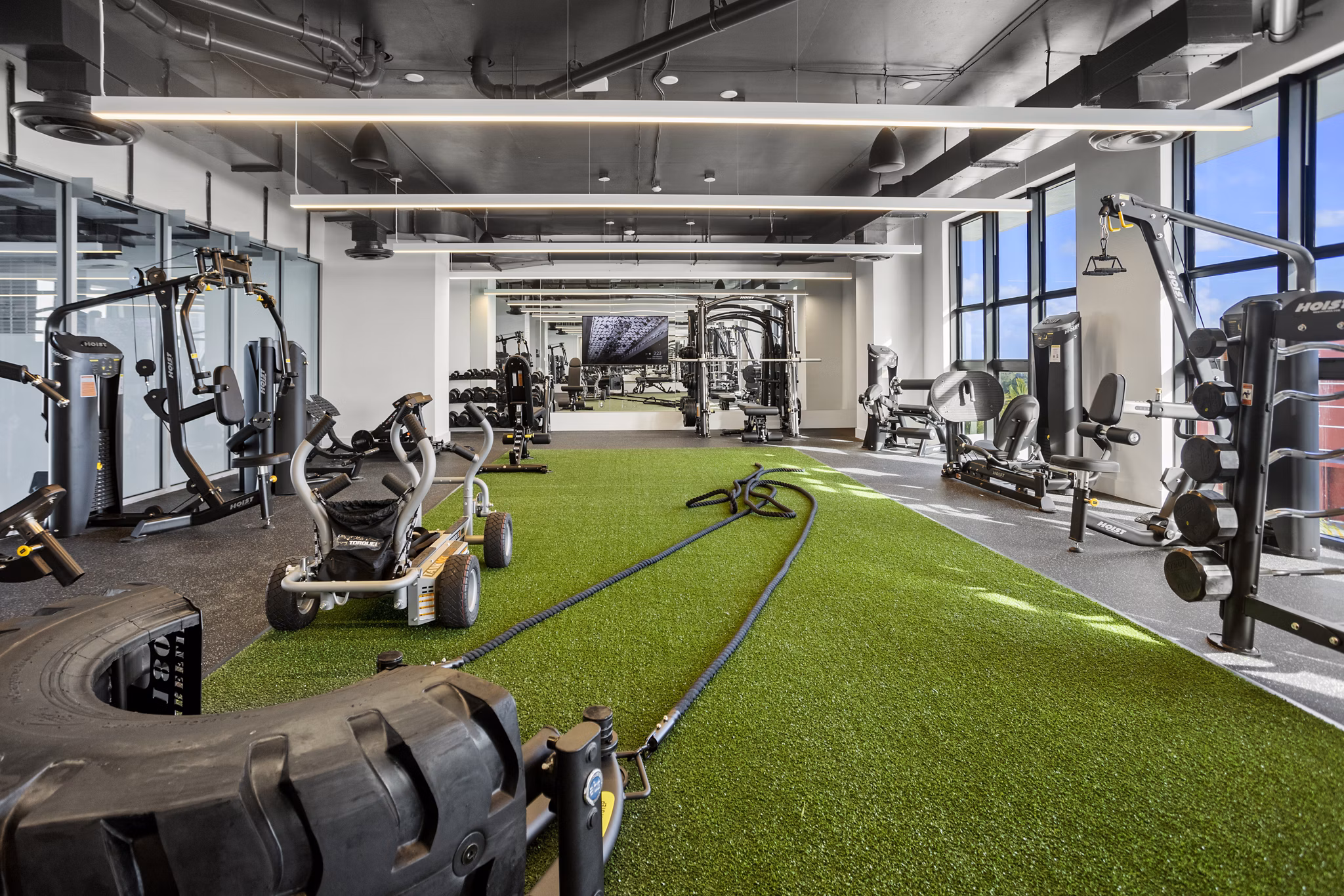State-of-the-art fitness center at Grove Central Residences Apartments offering modern exercise equipment and open workout spaces
