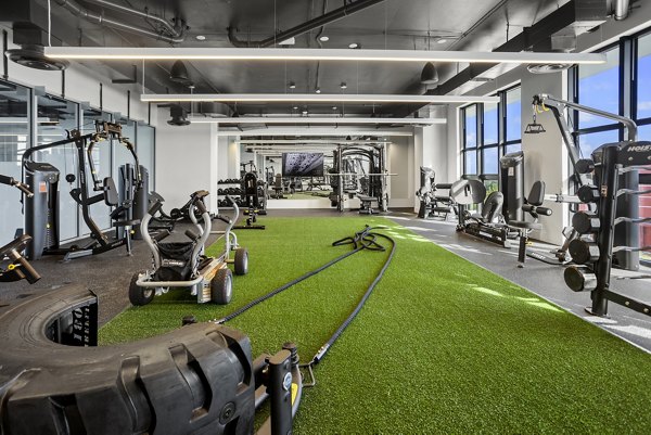 State-of-the-art fitness center at Grove Central Residences Apartments offering modern exercise equipment and open workout spaces