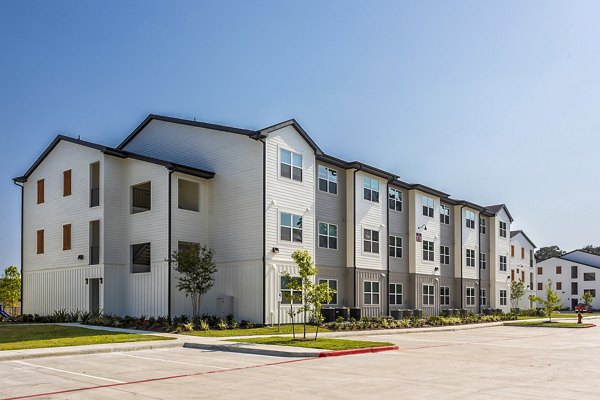 Modern luxury apartments with multiple stories and parking area in downtown location