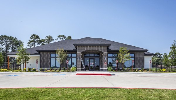 Modern luxury apartments with landscaped area in front, showcasing upscale living