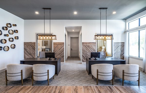 Modern office reception area featuring stylish desks and decorative lighting elements