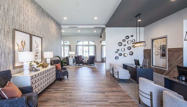 Elegant lobby with comfortable seating and decorative wall art in luxury apartments