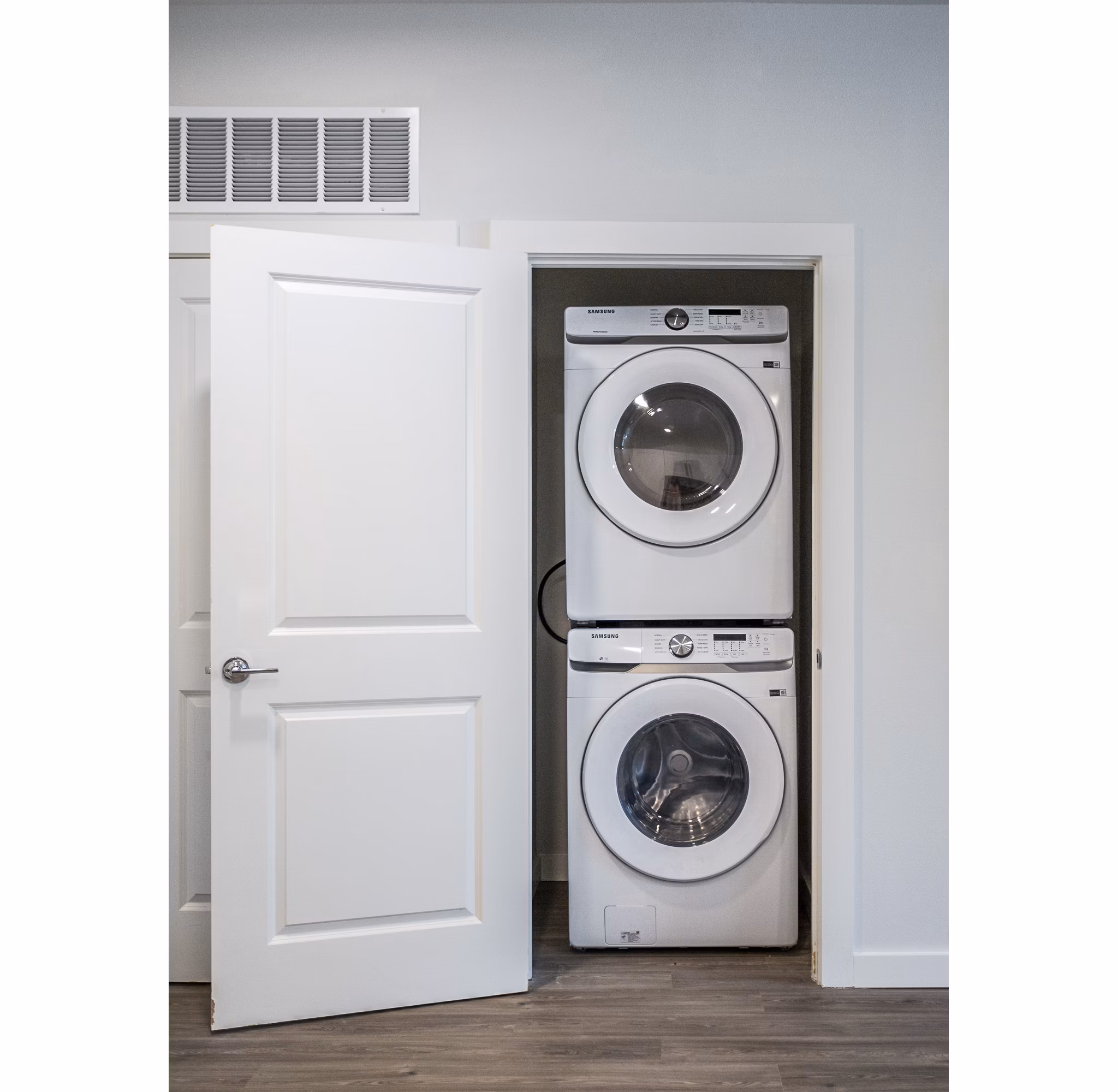 Convenient stacked washer and dryer in a luxury apartment closet