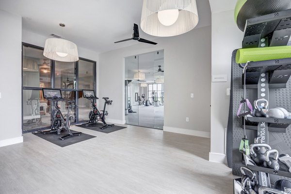 Yoga and spin studio with modern fitness equipment at Prospect Apartments