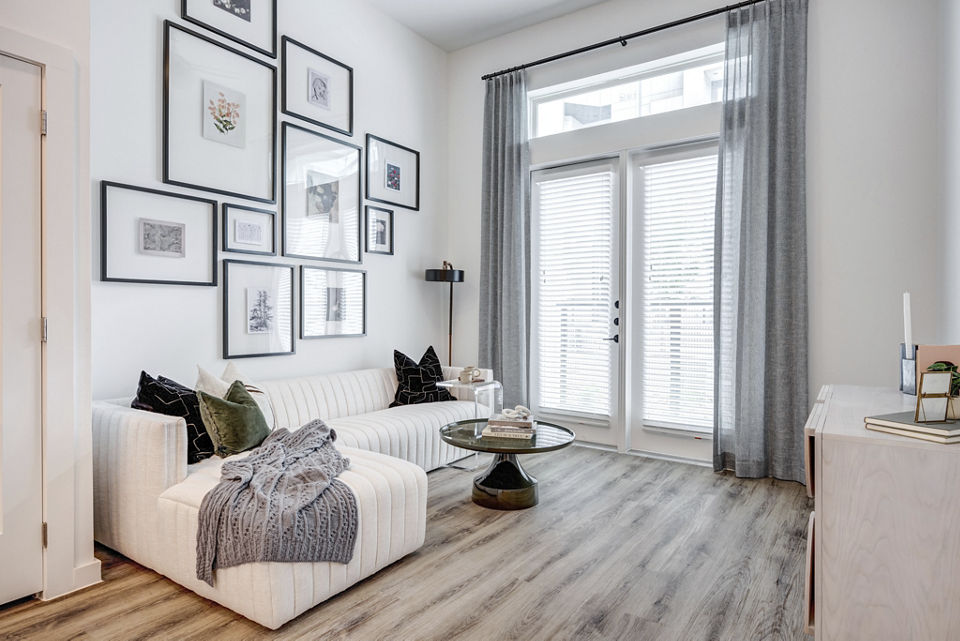 Spacious living room with modern furnishings at Prospect Apartments, a Greystar luxury property