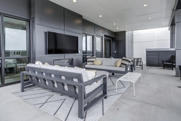 Modern outdoor patio with comfortable seating at Prospect Apartments