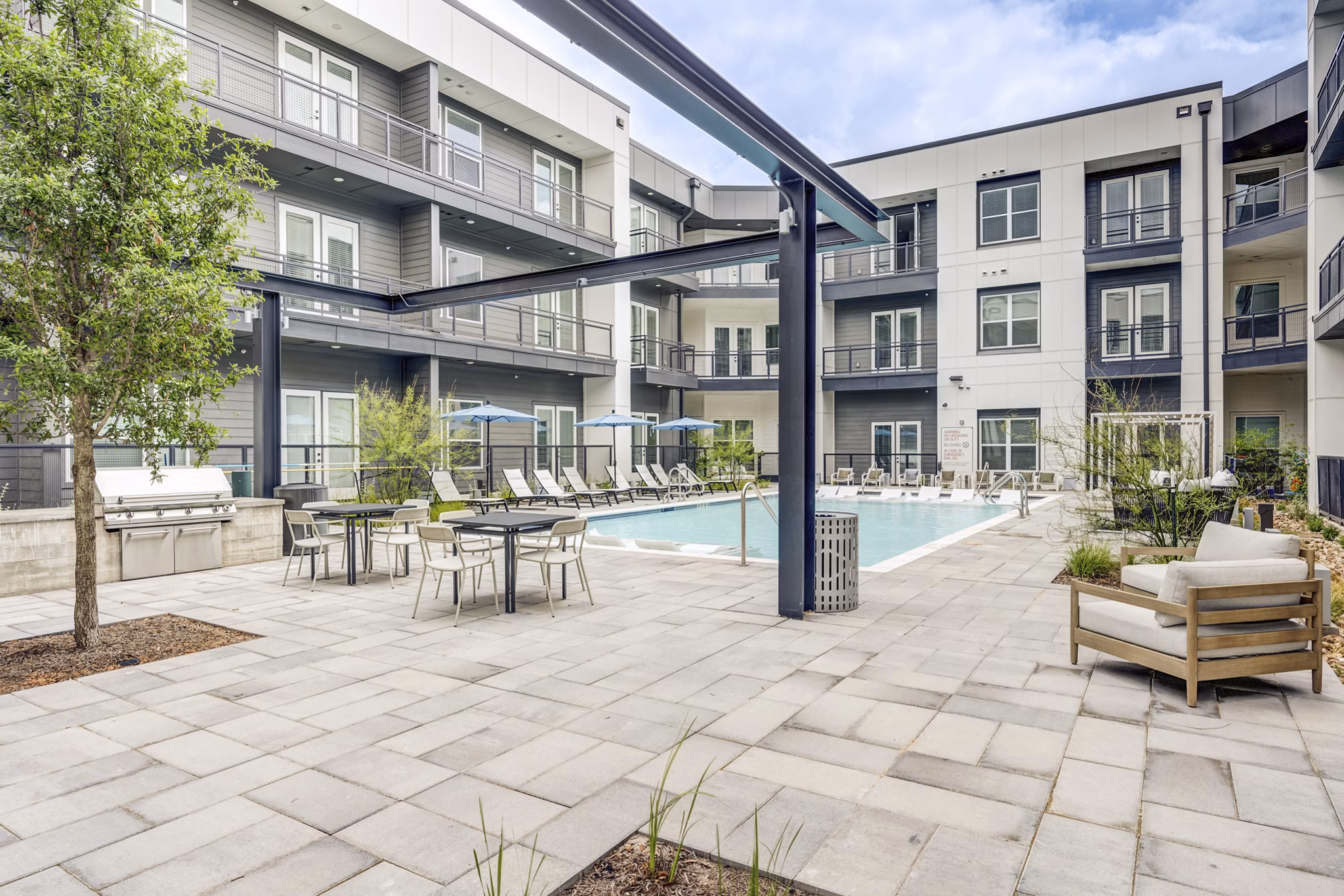 Chic outdoor courtyard with comfortable seating at Prospect Apartments