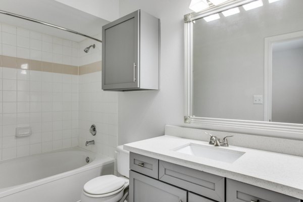 Bathroom featuring sleek fixtures and modern design at Oak Crest Apartments, a Greystar luxury residence