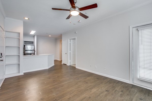 Spacious living room with modern furnishings at Oak Crest Apartments