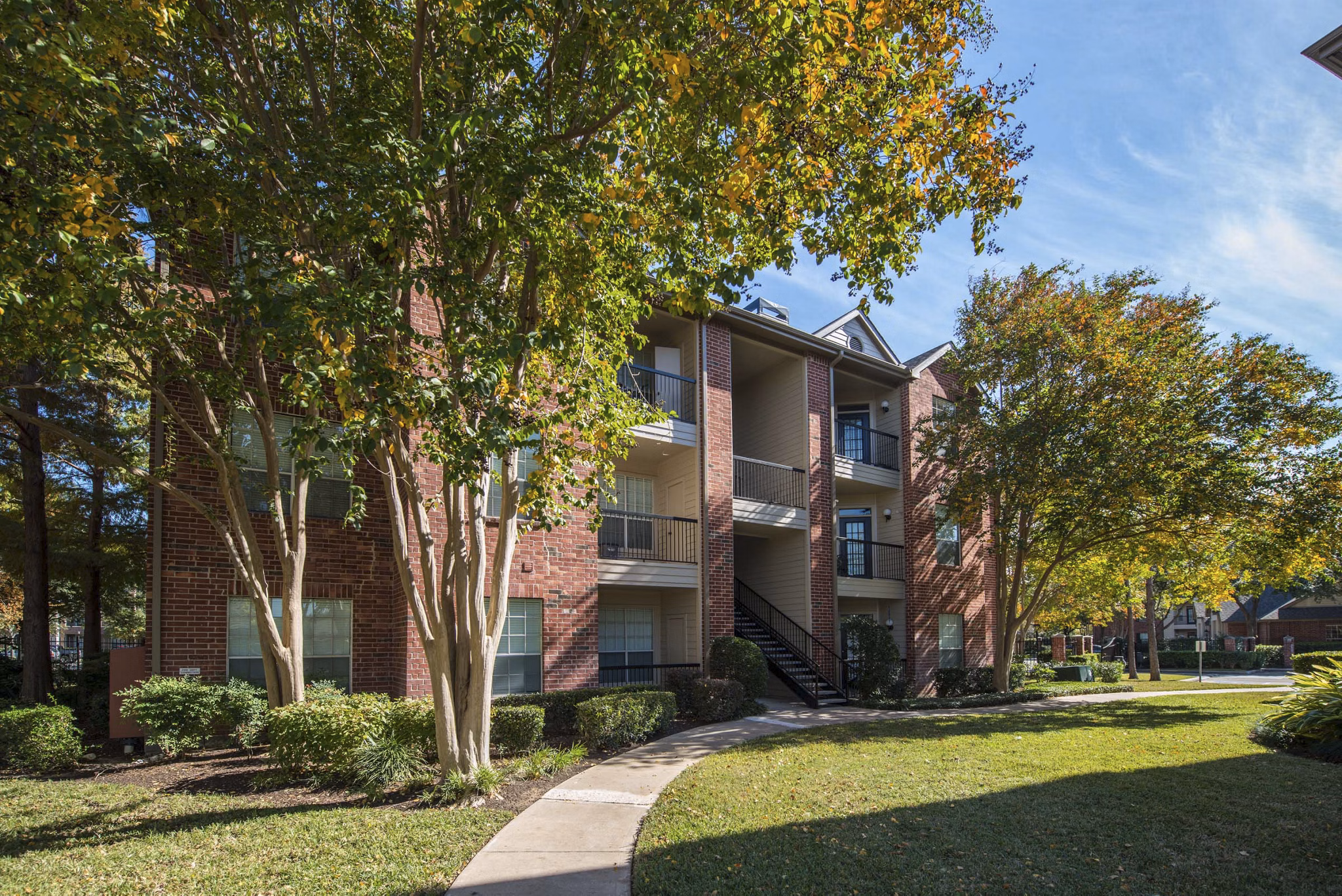 Woodland Park Apartments: Elegant high-rise building nestled in a serene area