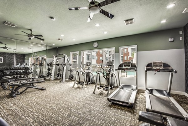 State-of-the-art fitness center featuring modern equipment at Woodland Park Apartments