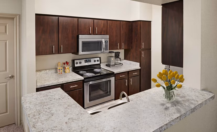 Kitchens with modern appliances at Woodland Park Apartments, luxury living experience available at Greystar's Woodland Park property