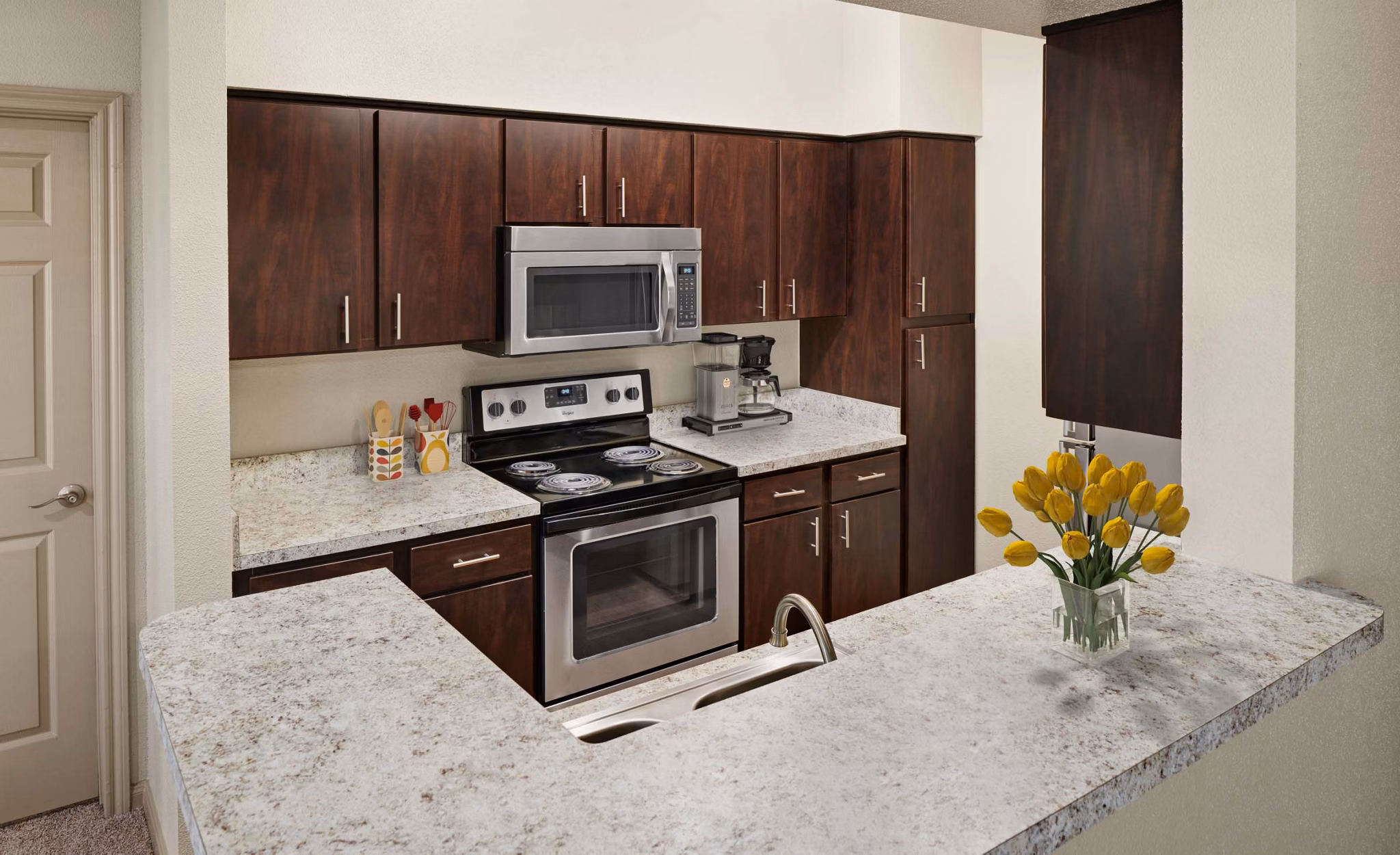 Kitchens with modern appliances at Woodland Park Apartments, luxury living experience available at Greystar's Woodland Park property