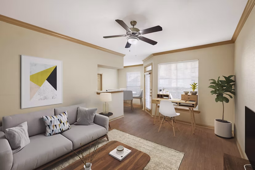 Contemporary living room with stylish decor and ample natural light at Woodland Park Apartments, perfect for modern urban living