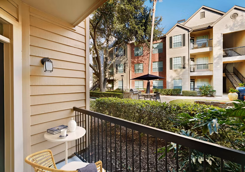 Patio with modern outdoor seating at Woodland Park Apartments, perfect for relaxing or entertaining in a luxurious Greystar community