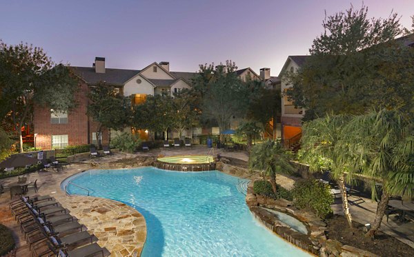 Poolside leisure area at Woodland Park Apartments offering relaxing amenities for residents