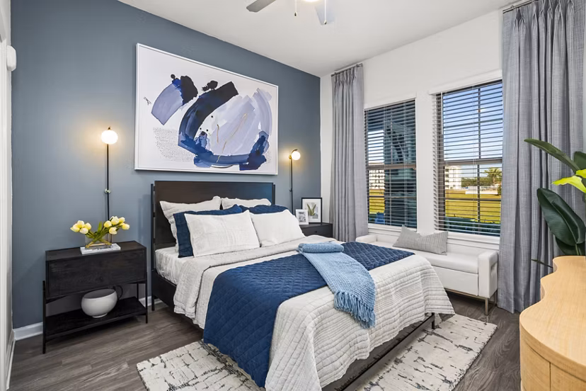 Sanctuary at Daytona Apartments: Elegant bedroom with plush furnishings and serene decor