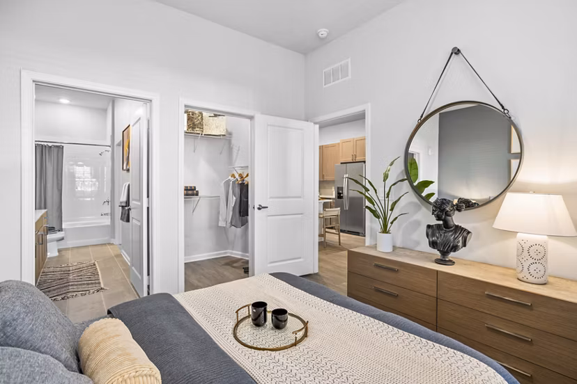 Sanctuary at Daytona Apartments: Cozy bedroom with modern furnishings and natural light