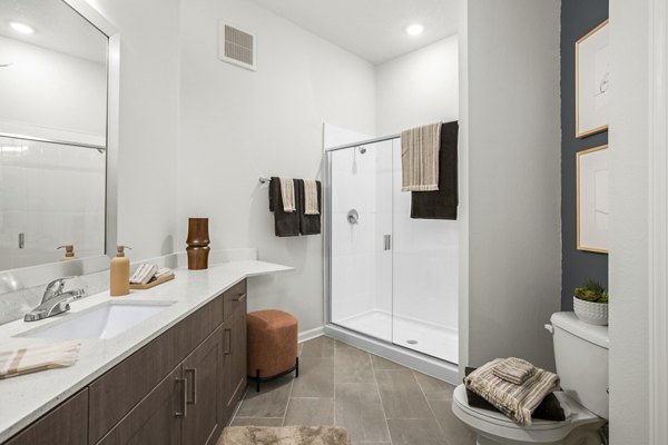 Bathroom with modern fixtures at Sanctuary at Daytona Apartments, a Greystar luxury property, highlighting sleek design and comfort in Daytona Beach
