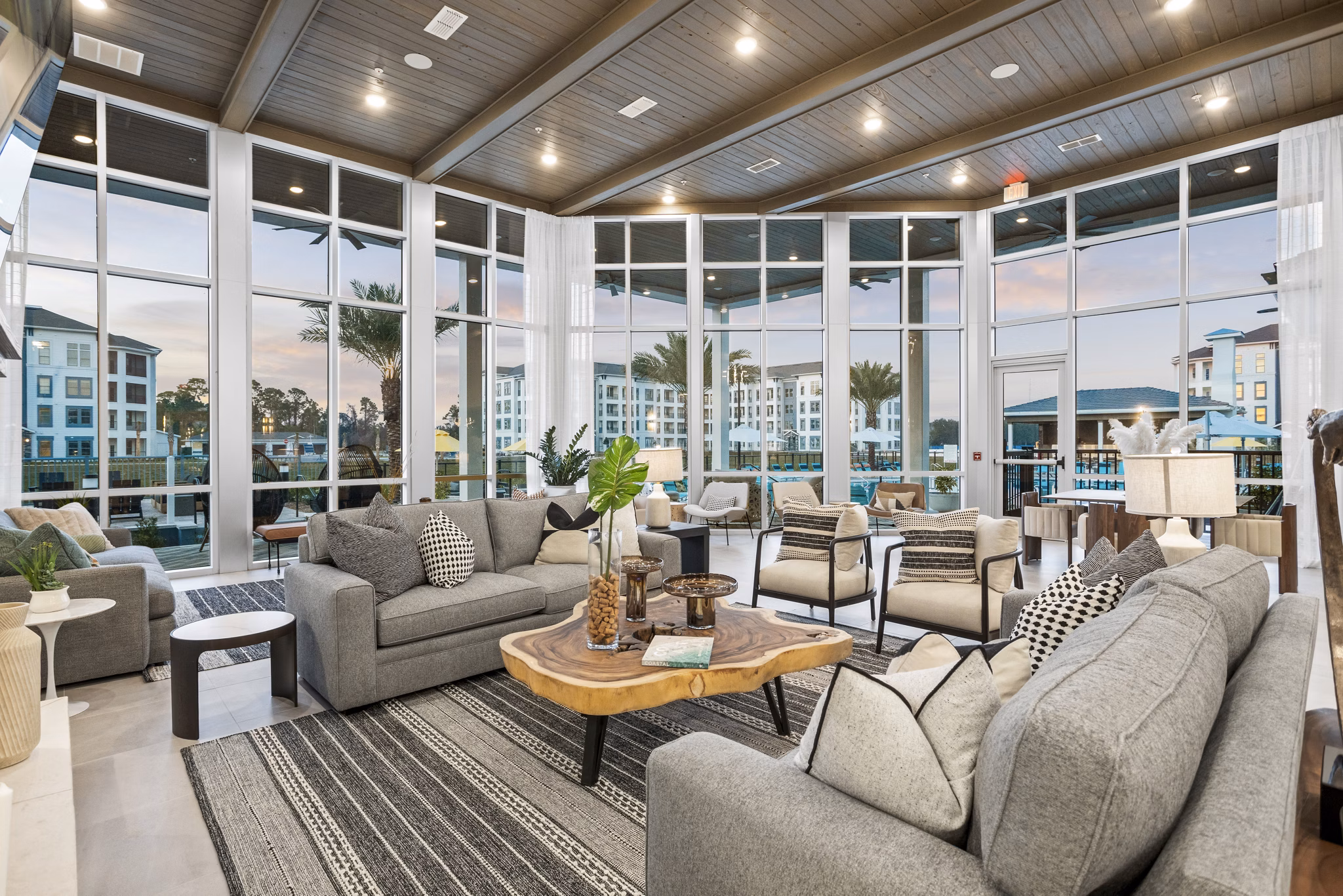 Contemporary clubhouse lobby with elegant seating at Sanctuary at Daytona Apartments