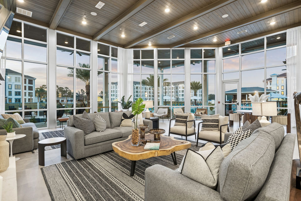 Contemporary clubhouse lobby with elegant seating at Sanctuary at Daytona Apartments