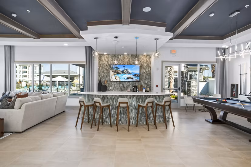 Sanctuary at Daytona Apartments: Elegant clubhouse lobby with modern furnishings and natural lighting