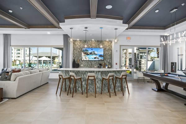Sanctuary at Daytona Apartments: Elegant clubhouse lobby with modern furnishings and natural lighting