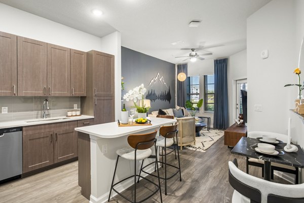 Modern kitchen with stainless steel appliances at Sanctuary at Daytona Apartments