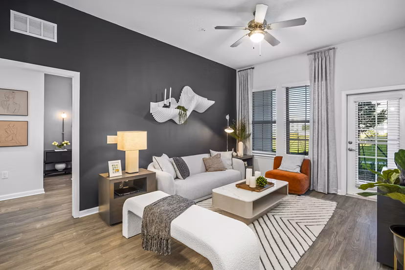 Spacious living room with modern furnishings at Sanctuary at Daytona Apartments